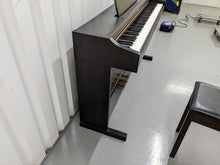Load image into Gallery viewer, Roland RP101 Digital Piano and matching stool in rosewood Stock # 23192
