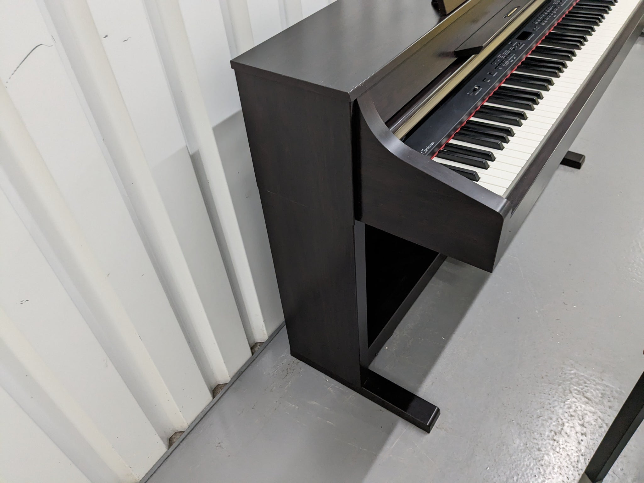 Yamaha Clavinova CLP-340 digital piano and stool in dark