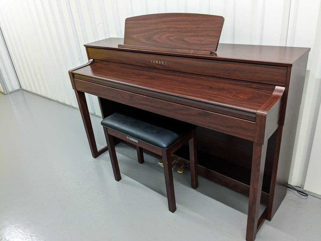 Yamaha Clavinova CLP-545 digital piano in mahogany with stool. stock nr 23284