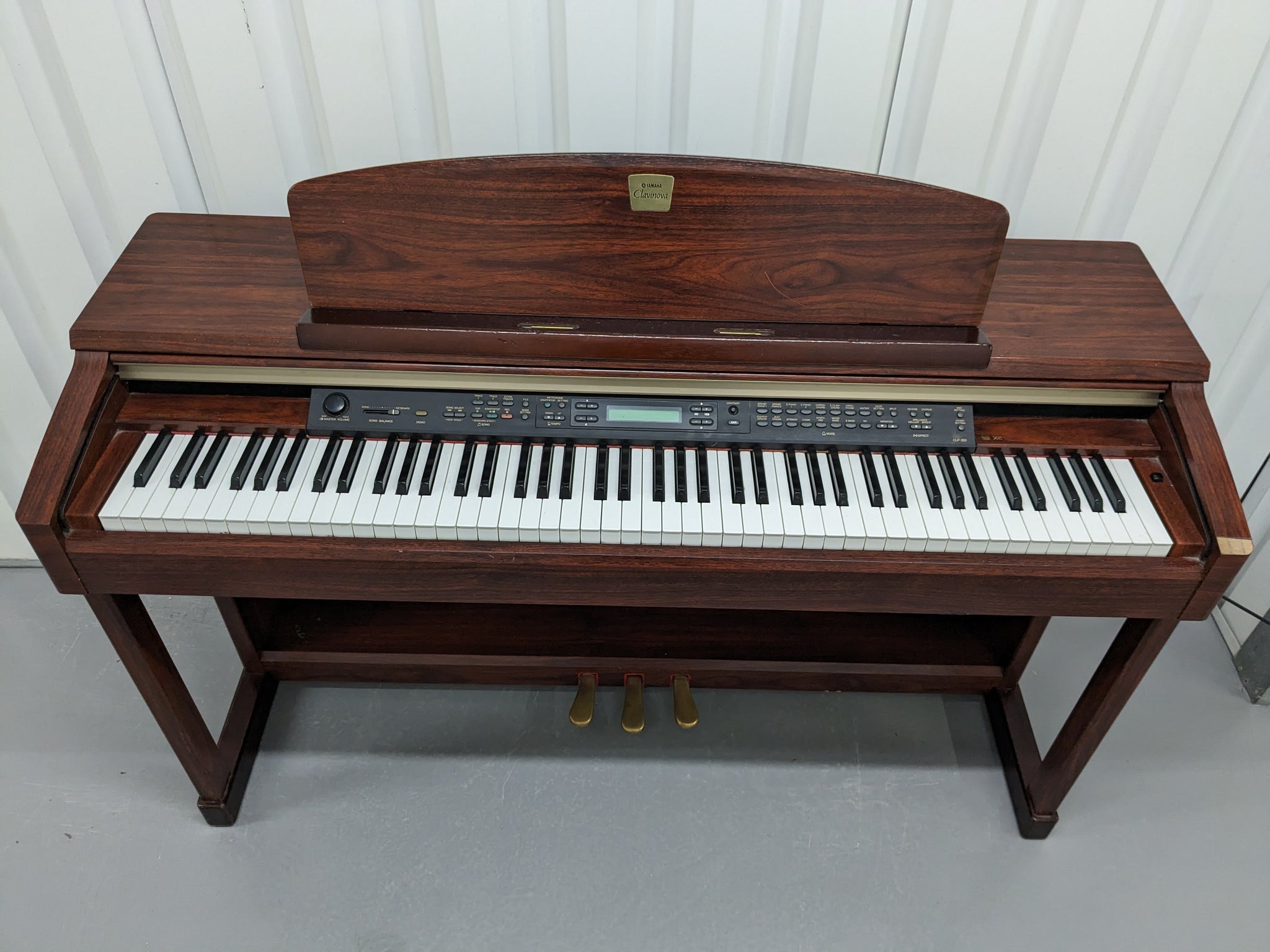 Yamaha Clavinova CLP-150 Digital Piano in mahogany colour stock nr