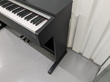 Load image into Gallery viewer, Yamaha Arius YDP-142 Digital Piano in satin black stock #23322
