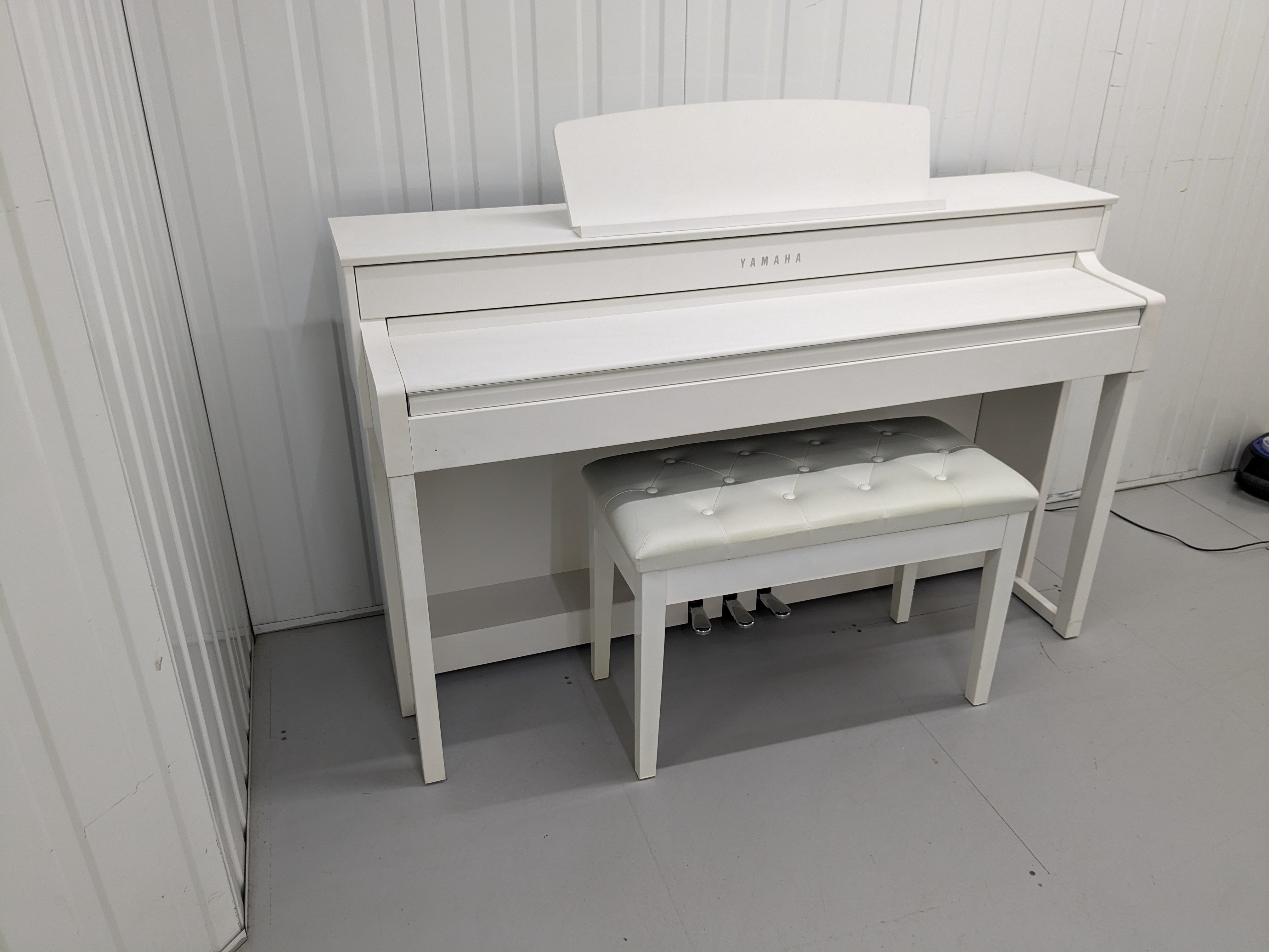 Yamaha Clavinova CLP-545 digital piano in satin white with stool