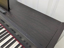 Load image into Gallery viewer, Roland RP401R digital piano and stool in dar rosewood finish stock number 23423
