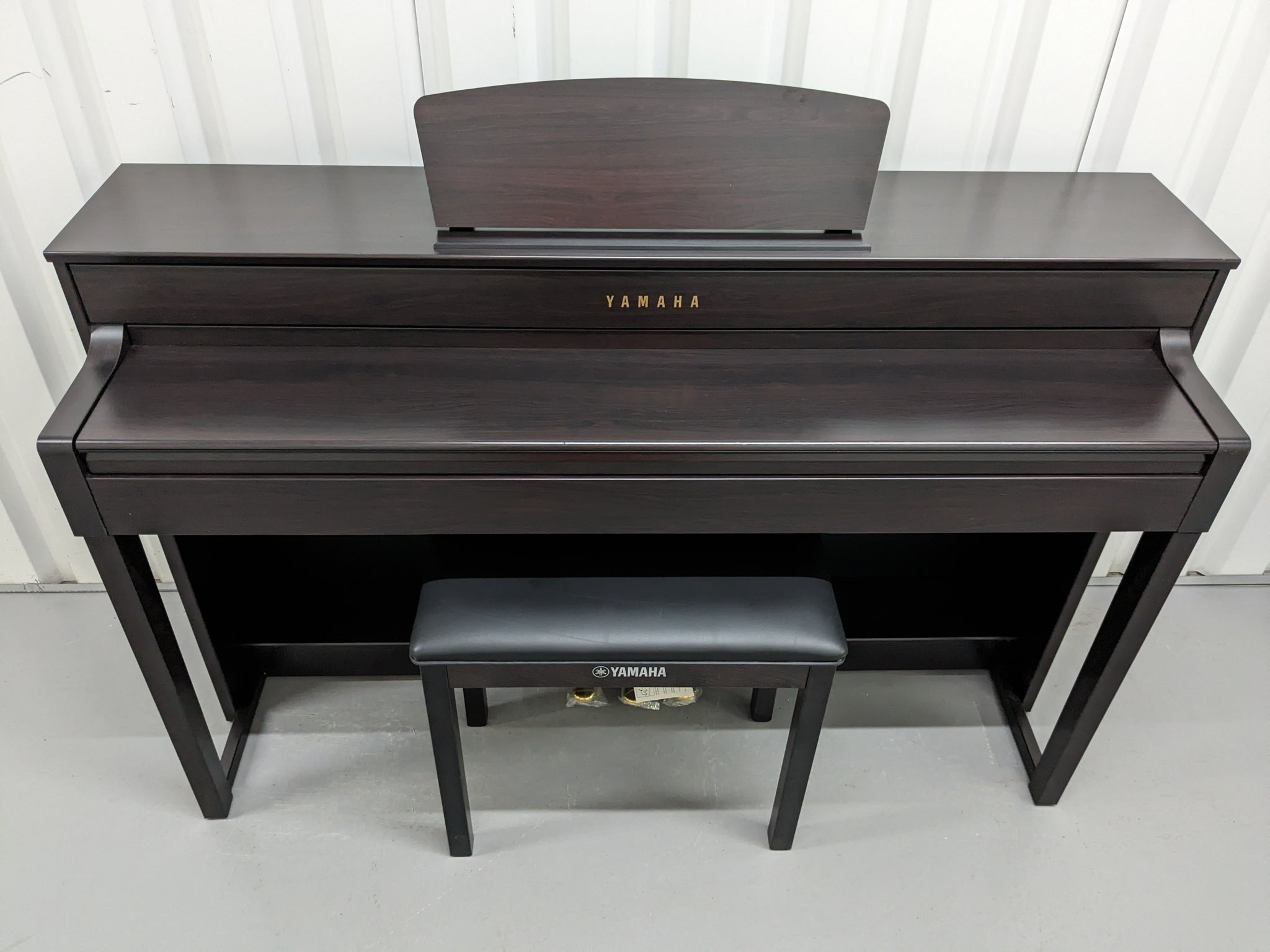 Yamaha Clavinova CLP-535 digital piano and stool in dark
