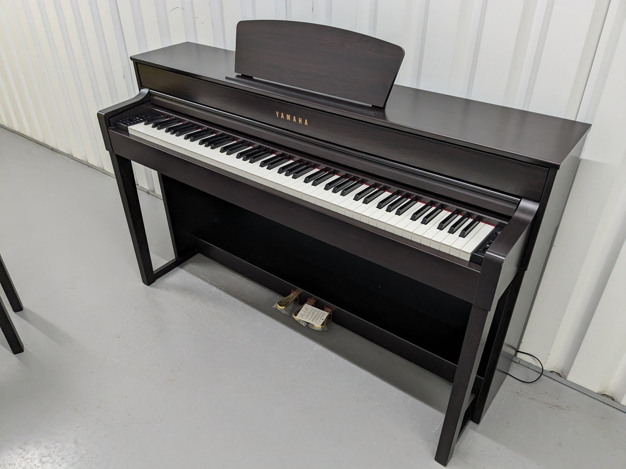 Yamaha Clavinova CLP-535 digital piano and stool in dark