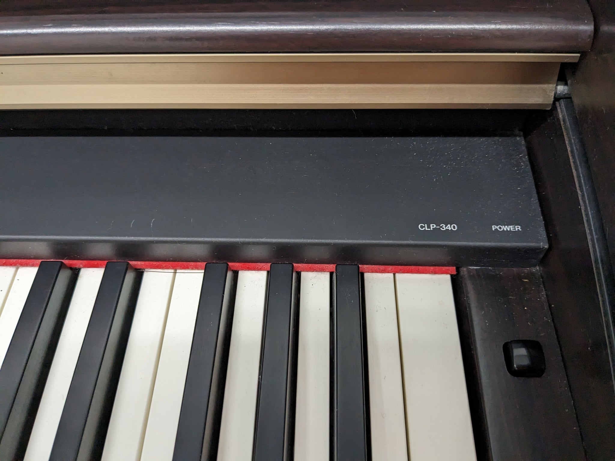 Yamaha Clavinova CLP-340 Digital Piano and stool in dark