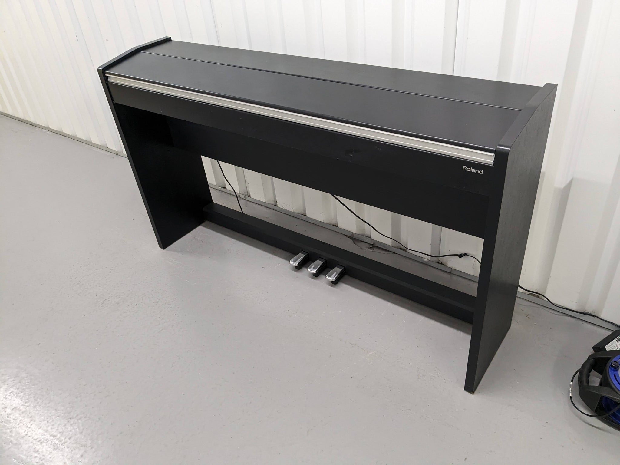 Roland F130R Digital Piano in black with matching colour stool