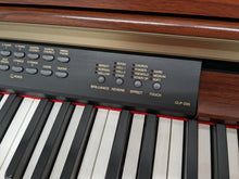 Load image into Gallery viewer, Yamaha Clavinova CLP-230 Digital Piano and stool in mahogany stock nr 24044
