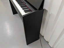 Load image into Gallery viewer, Roland F130R compact slim size Digital Piano in black  stock # 24006
