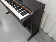 Load image into Gallery viewer, Roland HP101e digital piano and stool in dark rosewood finish stock #24061
