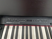 Load image into Gallery viewer, Roland F140R Digital Piano in black with matching colour stool stock # 24063
