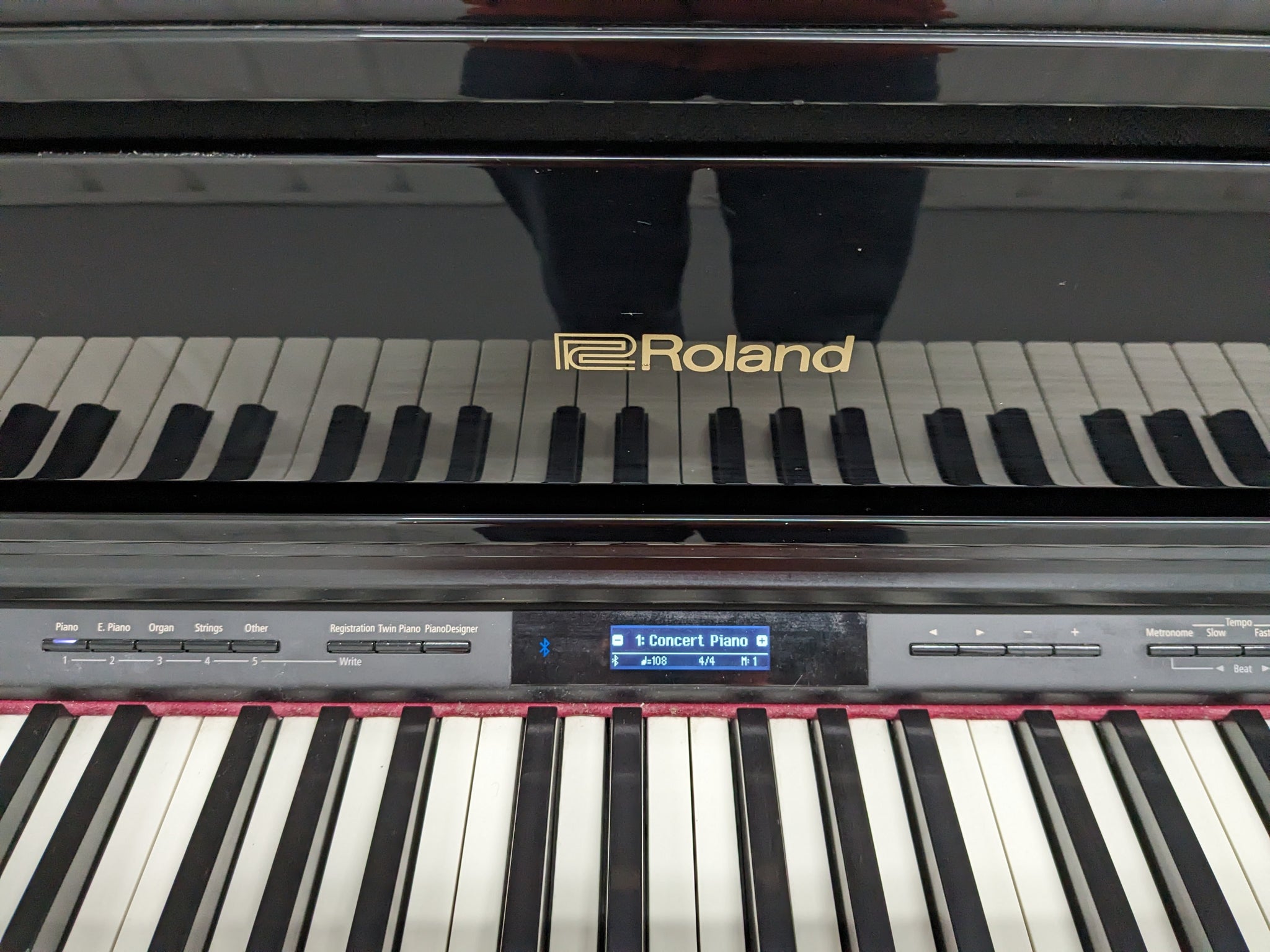 Roland HP605 digital piano and stool in glossy black