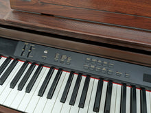 Load image into Gallery viewer, Yamaha Clavinova CLP-860 Digital Piano and stool in mahogany stock # 24096
