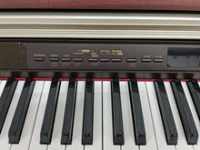 Load image into Gallery viewer, Casio Celviano AP-500 digital piano in mahogany colour stock number 24115
