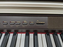 Load image into Gallery viewer, Casio Celviano AP-500 digital piano in mahogany colour stock number 24115
