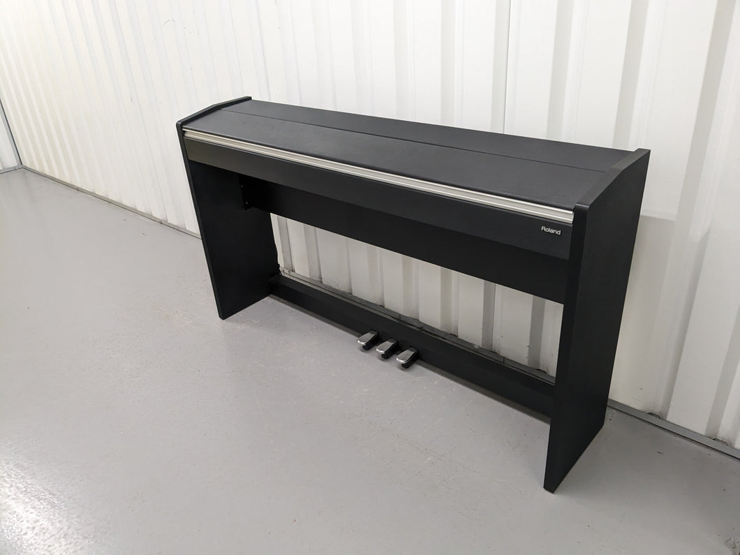 Roland F-110 compact slim size Digital Piano in black  stock # 24126