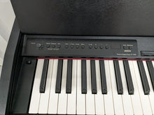 Load image into Gallery viewer, Roland F-110 compact slim size Digital Piano in black  stock # 24126
