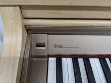 Load image into Gallery viewer, Roland HP102e digital piano and stool in light oak finish stock number 24134
