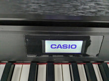 Load image into Gallery viewer, Casio Celviano AP-700 digital piano and stool in satin black finish stock #24167
