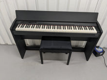 Load image into Gallery viewer, Roland F120R compact slim size Digital Piano and stool in black  stock # 24279
