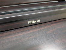 Load image into Gallery viewer, Roland HP103e digital piano in dark rosewood finish stock number 24333
