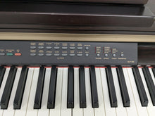 Load image into Gallery viewer, Yamaha Clavinova CLP-130 Digital Piano in dark rosewood stock #24358
