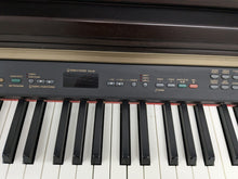 Load image into Gallery viewer, Yamaha Clavinova CLP-130 Digital Piano in dark rosewood stock #24358
