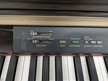 Load image into Gallery viewer, Yamaha Clavinova CLP-130 Digital Piano in dark rosewood stock #24358
