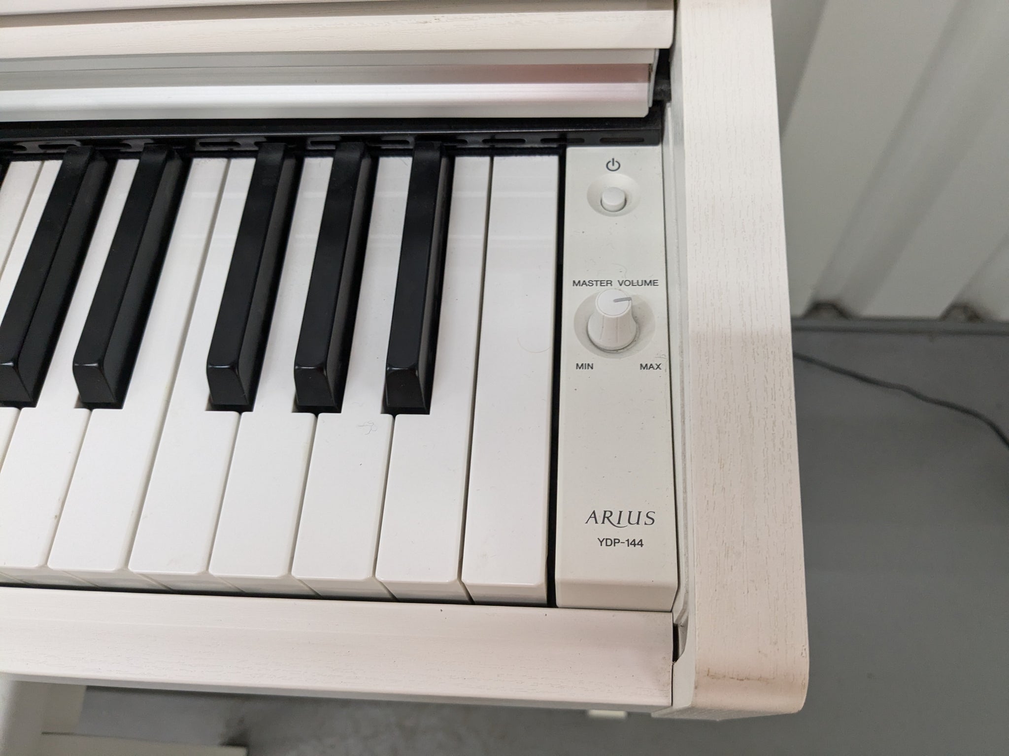 Yamaha Arius YDP-144 digital piano and stool in satin white stock