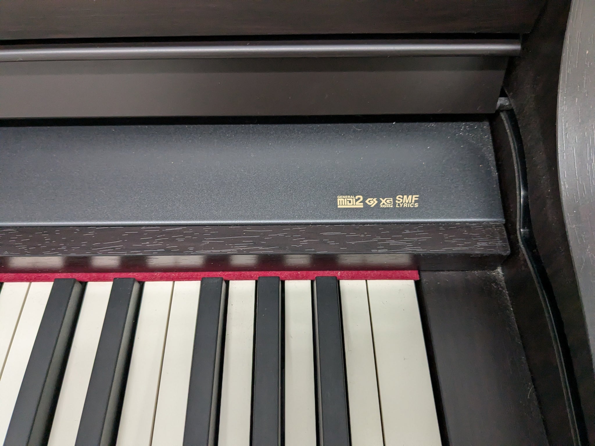 Roland HP-307 Digital Piano in dark rosewood wooden action keys