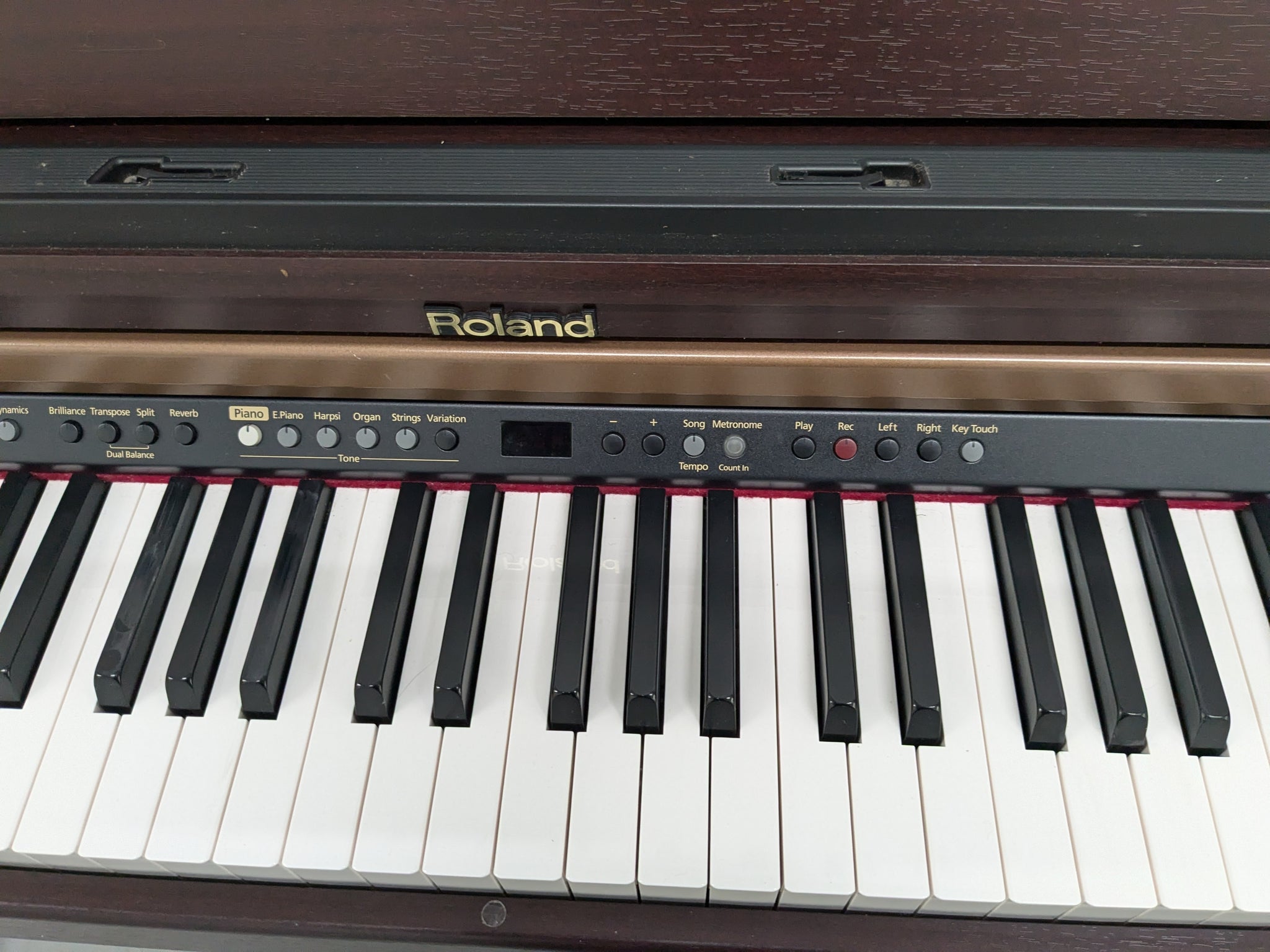 Roland HP103e digital piano in mahogany finish stock number 24431 