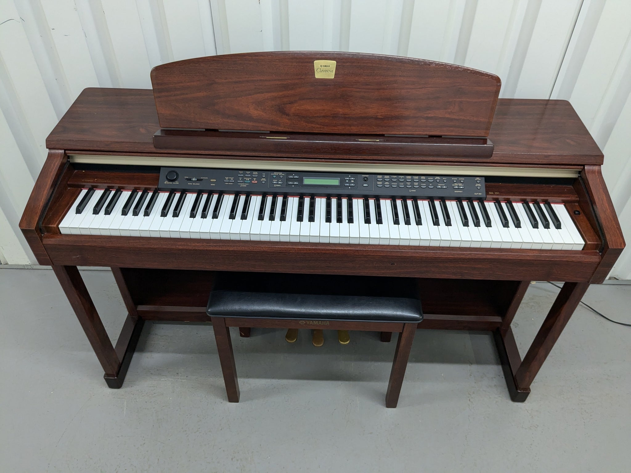 Yamaha Clavinova CLP-150 digital piano and stool in mahogany stock
