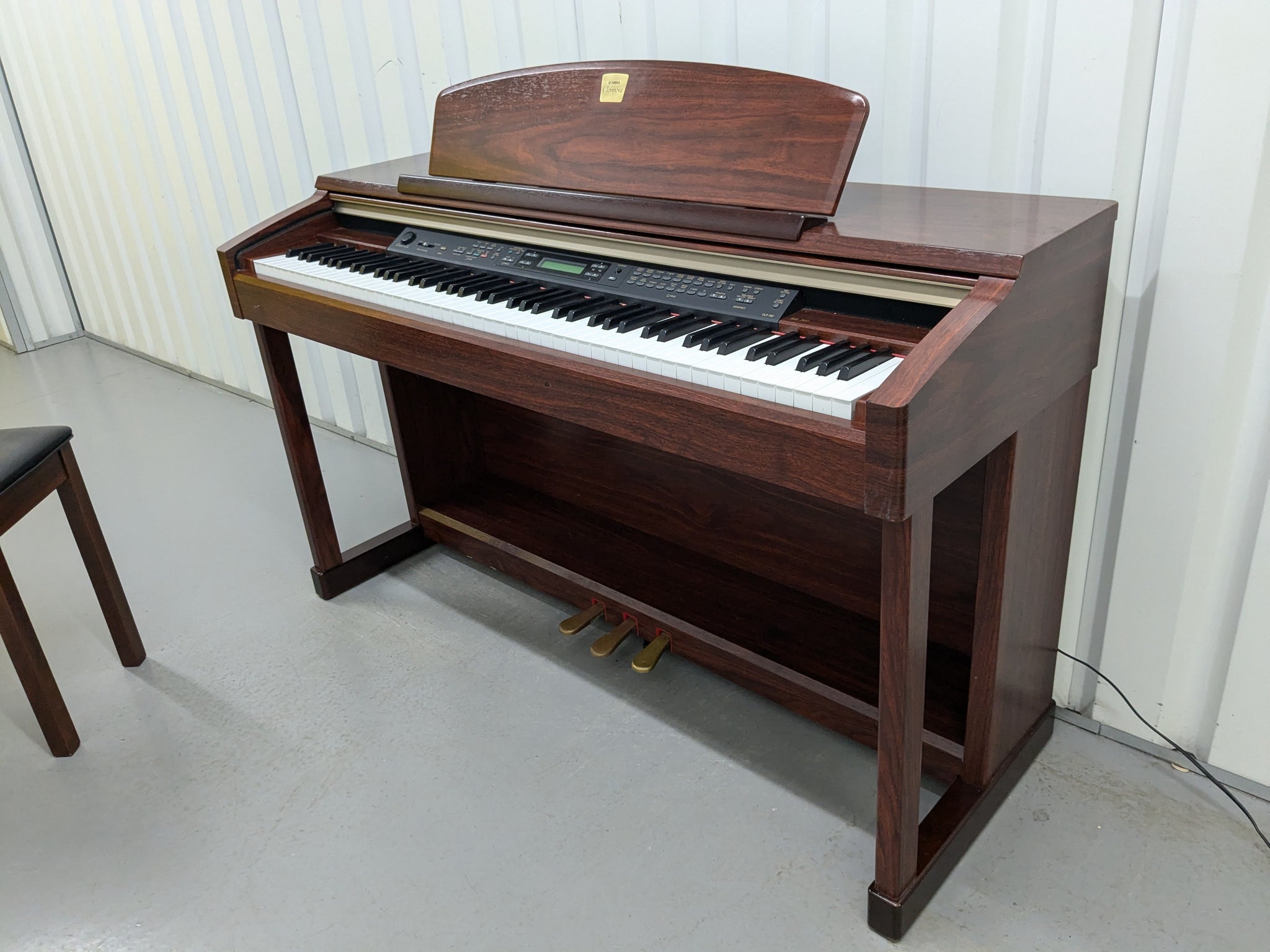 Yamaha Clavinova CLP-150 digital piano and stool in mahogany stock