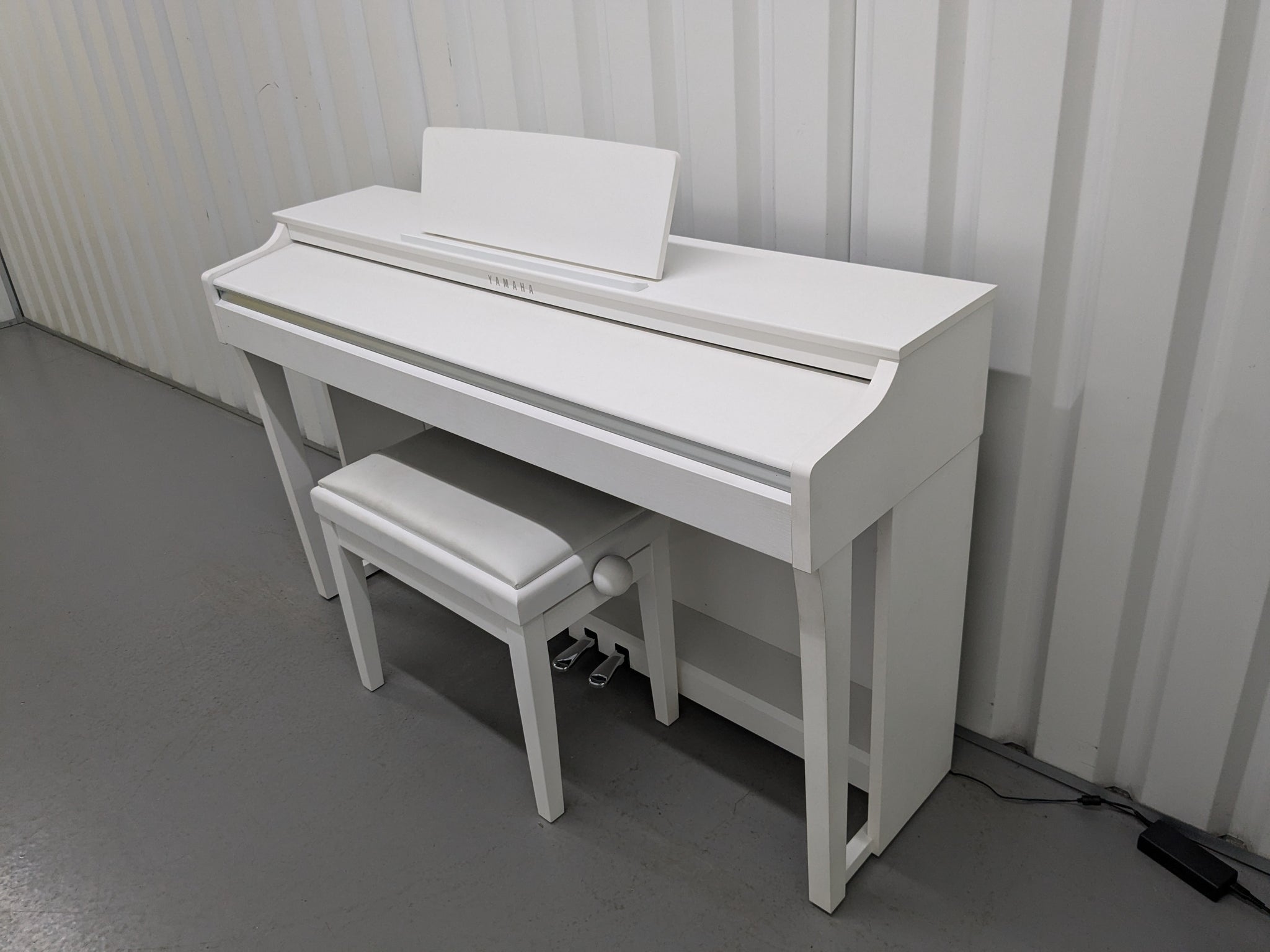 Yamaha Clavinova CLP 625 digital piano and stool in satin white stock Sulinda Music