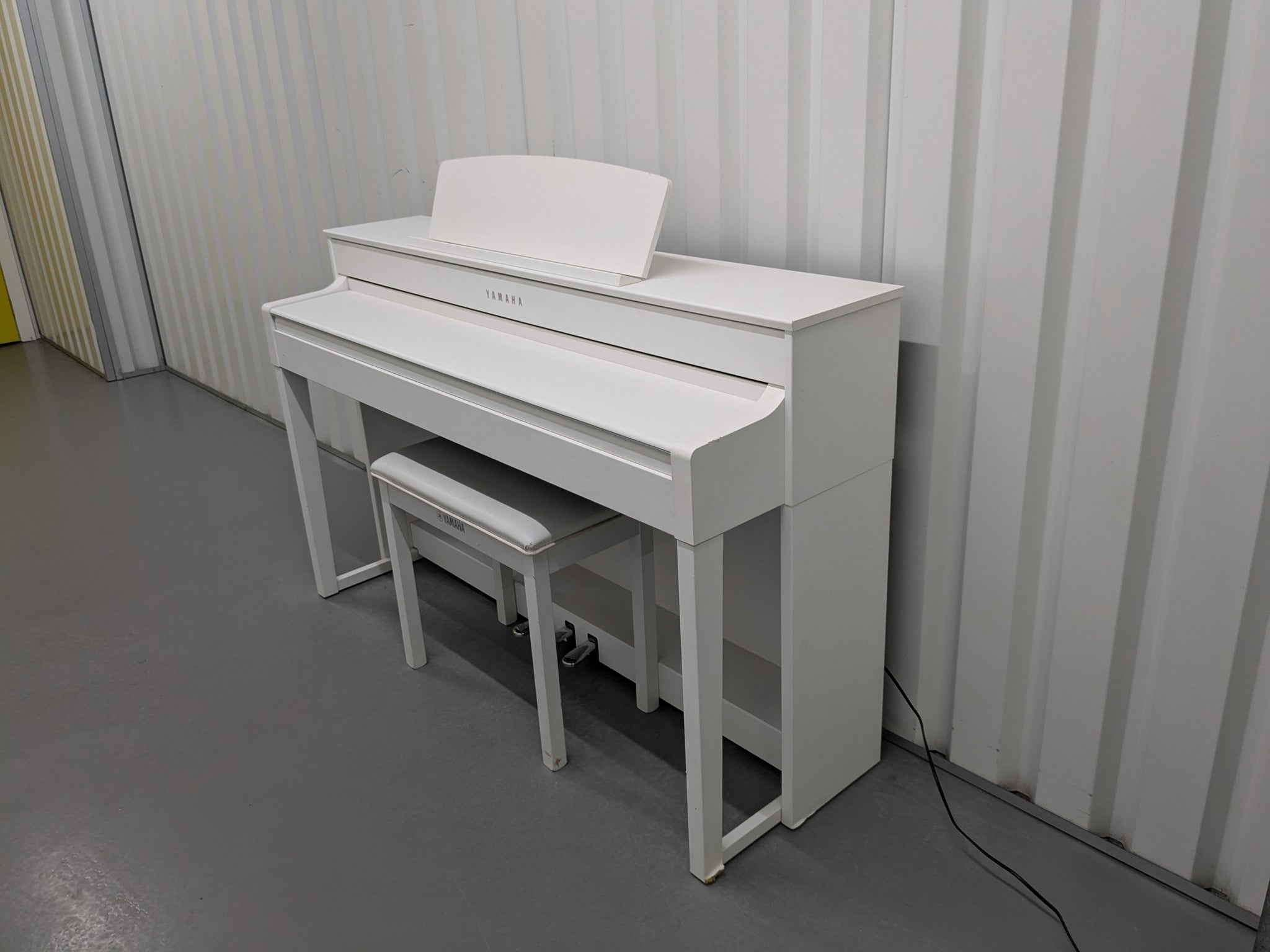 Yamaha Clavinova CLP-545 digital piano in satin white with stool