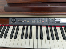 Load image into Gallery viewer, Yamaha Clavinova CLP-150 digital piano and stool in mahogany stock #24519
