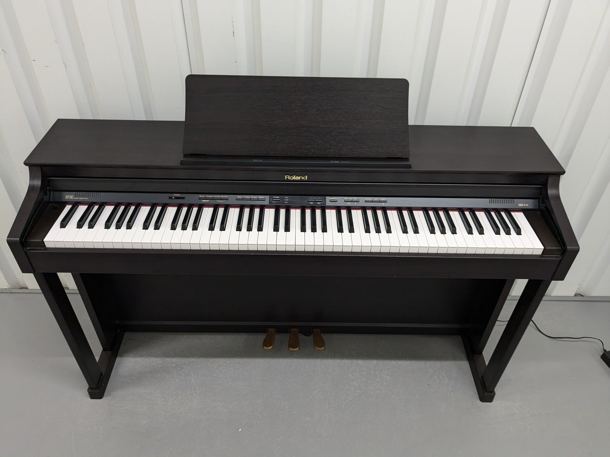 Roland HP302 digital piano and stool in dark rosewood finish