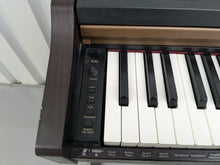 Load image into Gallery viewer, Roland HP101e Digital Piano and stool in dark rosewood finish stock # 24557
