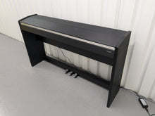 Load image into Gallery viewer, Roland F110 compact slim size Digital Piano in black  stock # 24580
