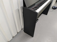 Load image into Gallery viewer, Roland F110 compact slim size Digital Piano in black  stock # 24580
