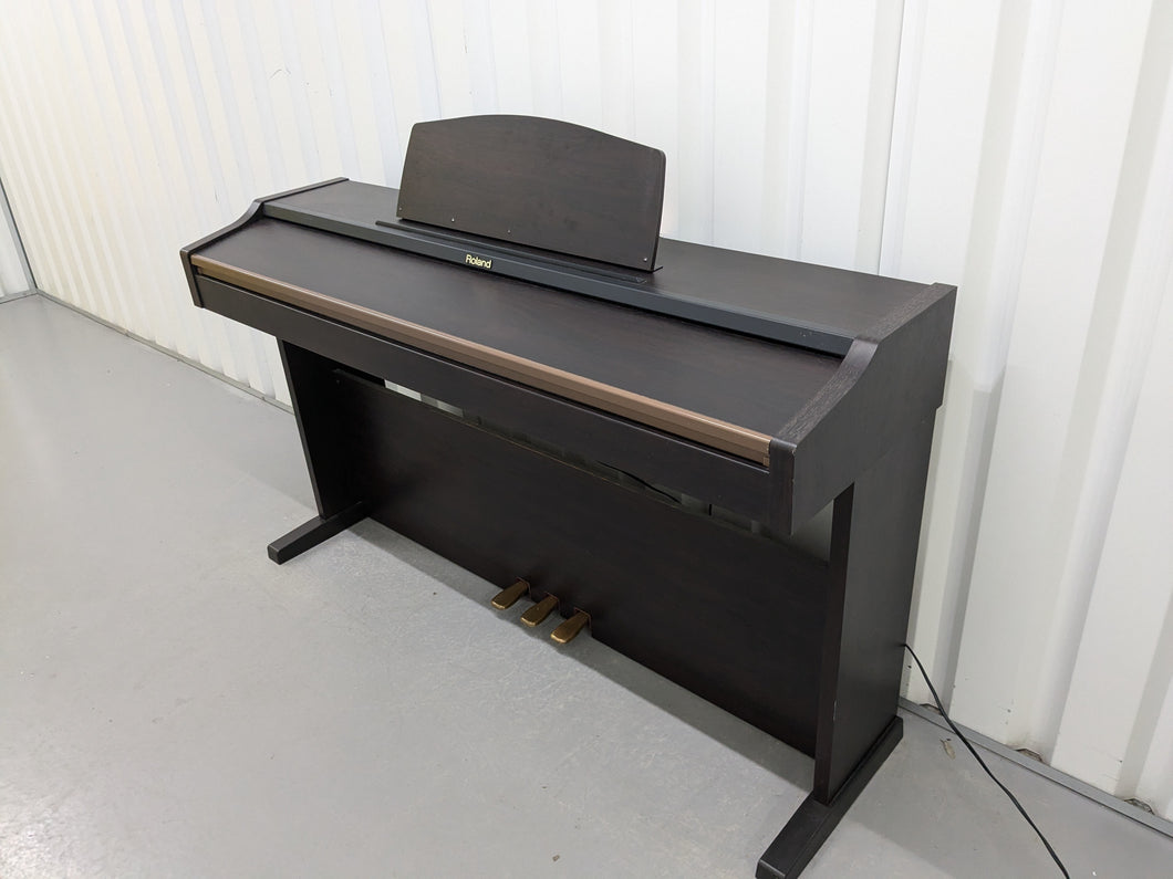 Roland HP101e Digital Piano in dark rosewood finish stock # 24589