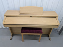 Load image into Gallery viewer, Roland HP102e digital piano and stool in light oak finish stock number 24614
