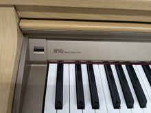 Load image into Gallery viewer, Roland HP102e digital piano and stool in light oak finish stock number 24614
