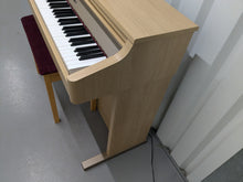 Load image into Gallery viewer, Roland HP102e digital piano and stool in light oak finish stock number 24614
