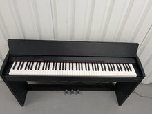 Load image into Gallery viewer, Roland F110 compact slim size Digital Piano in black  stock # 24652
