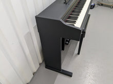 Load image into Gallery viewer, Roland RP102 digital piano and stool in satin black finish stock number 25008
