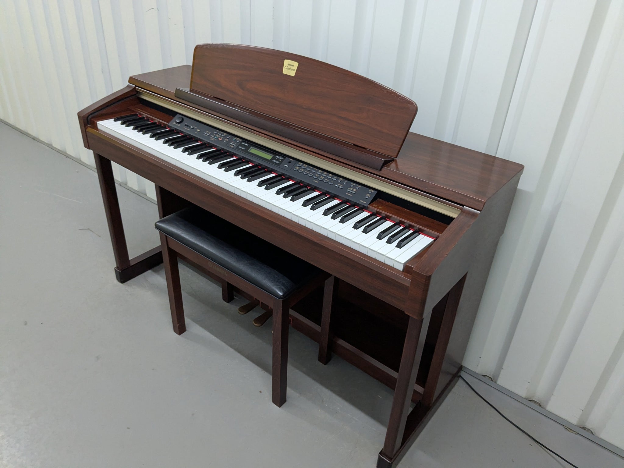 Yamaha Clavinova CLP-150 digital piano and stool in mahogany stock
