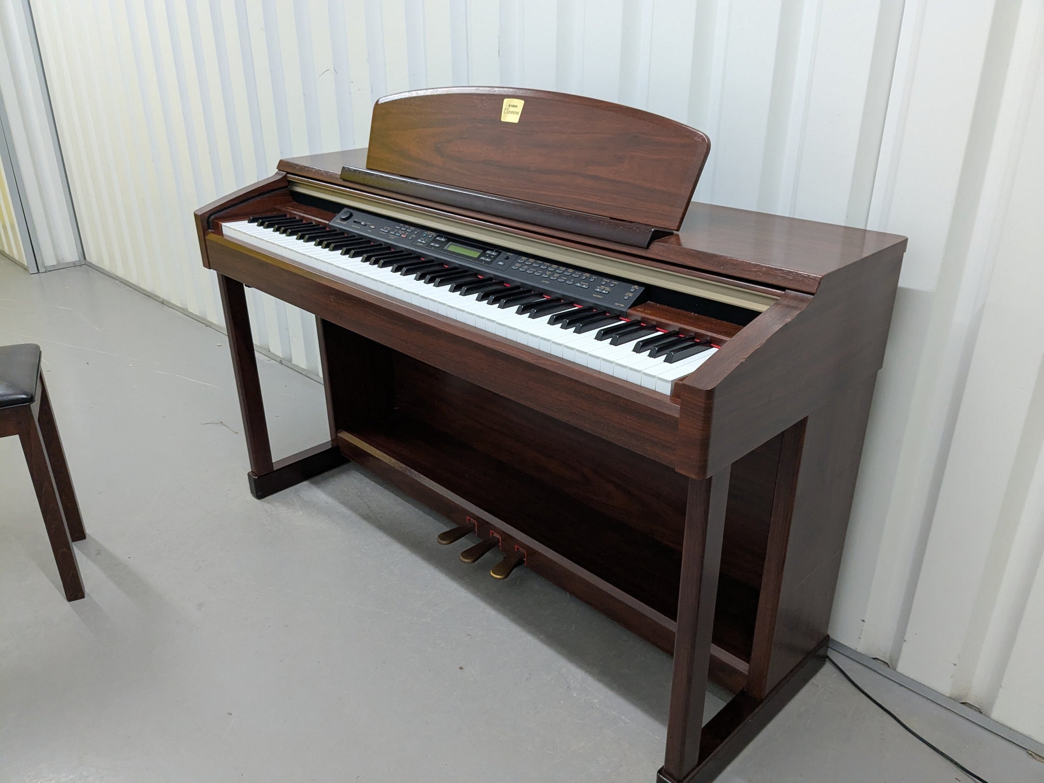 Yamaha Clavinova CLP-150 digital piano and stool in mahogany