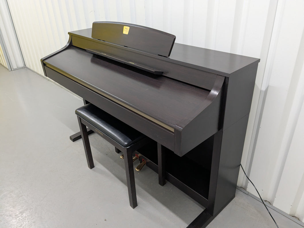 Yamaha Clavinova CLP-340 Digital Piano and stool in dark