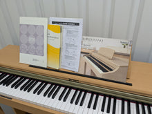Load image into Gallery viewer, Roland HP201 digital piano and stool in light oak finish stock number 25085
